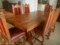 Large-Dining-Table-with-leather-cushioned-chairs